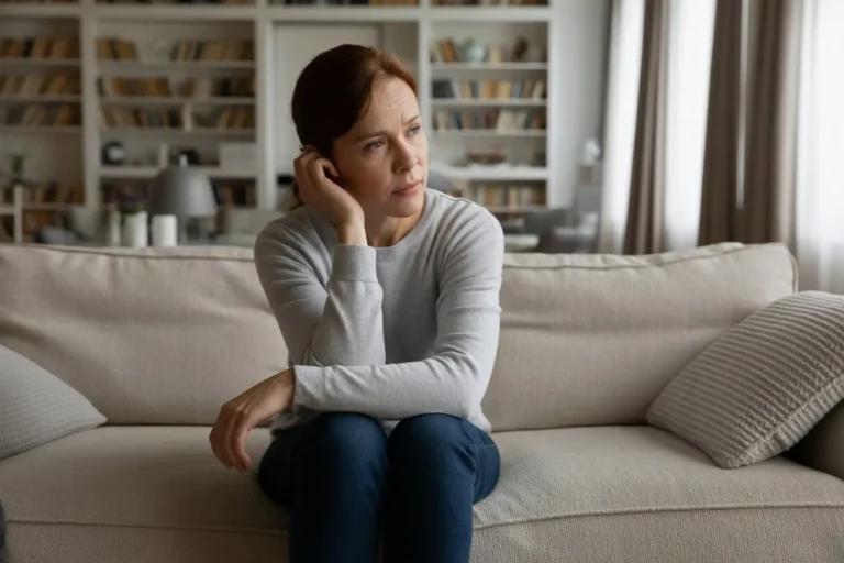 Your-Life-Looks-Fine-So-Why-Do-You-Feel-Off-A-tired-lady-sitting-on-couch-in-her-clean-living-room